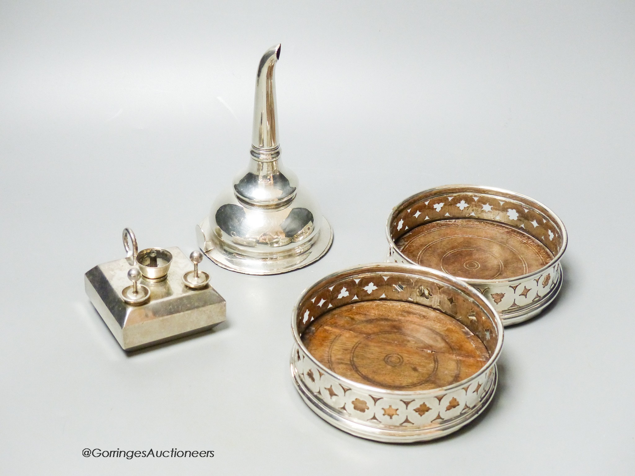 A silver plated wine funnel, a pair of plated coasters and a novelty cigar lamp